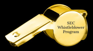 Gold whistle with the words SEC Whistleblower Program imprinted on the side.